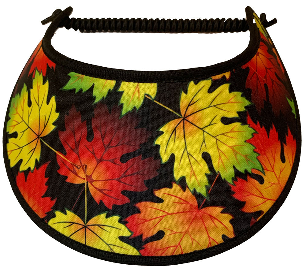 Fall leaves in colors of red green and yellow on black