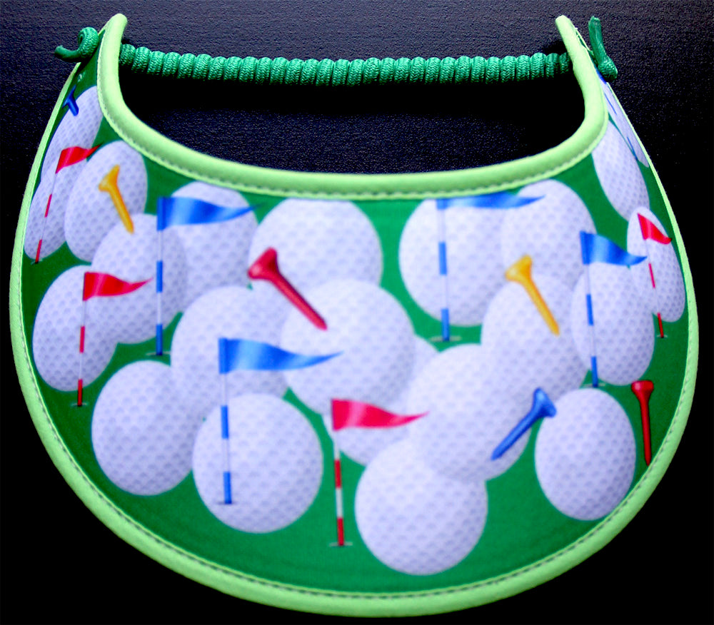 Golf Sun Visor with Large Balls and Tees on Green