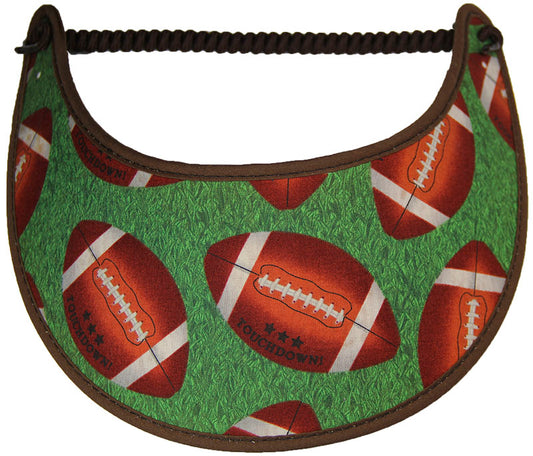 Ladies sun visor with footballs on a green background