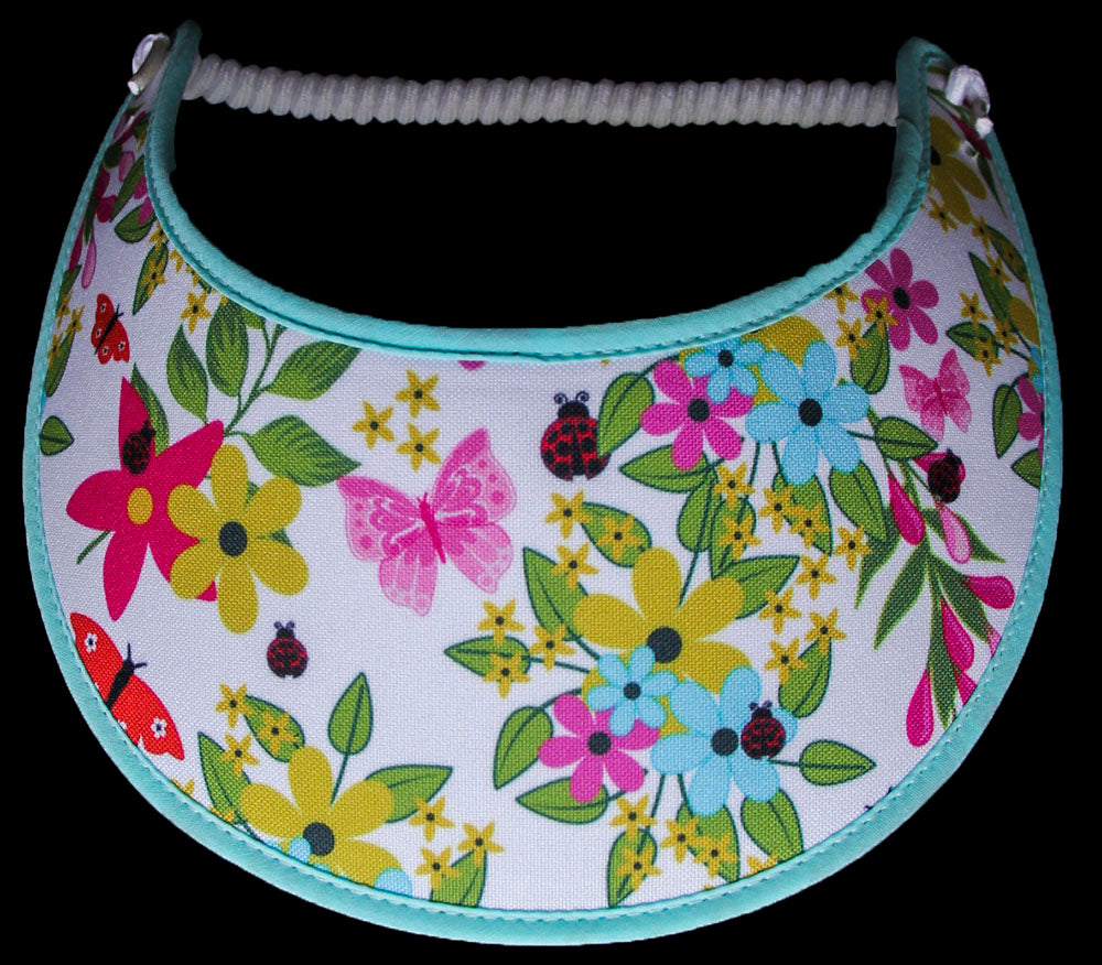 Ladies foam sun visor with flowers, butterflies, and lady bugs on white