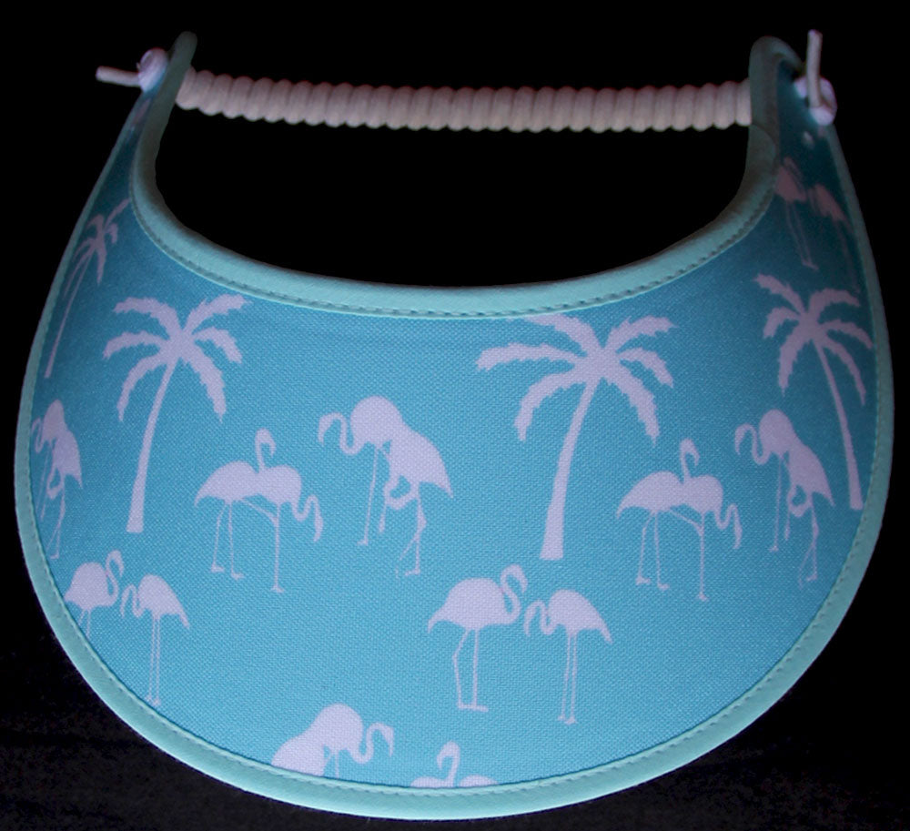 Foam sun visor with palm trees and flamingos on aqua.